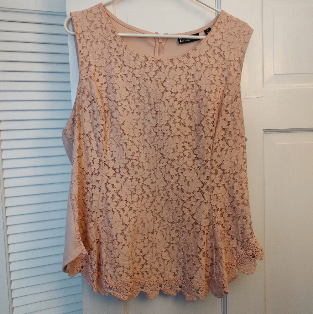 Sleeveless Blush Peplum Style Top